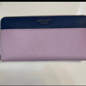 Beautiful Kate Spade wallet.  Roomy and very light use.